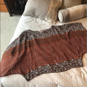 See though tunic with large billowing sleeves